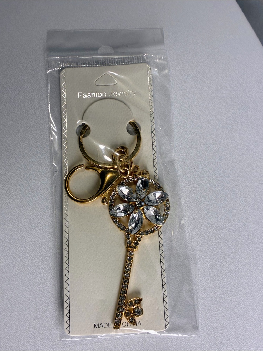 Gold Key Charm with Clear Crystal White Flower Petals New Without Tags